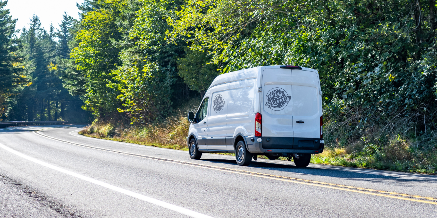 King Laundry delivery van traveling down the open road.